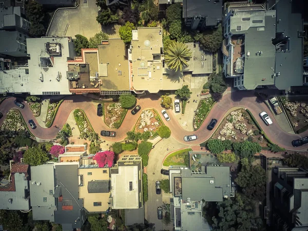 Vintage tone aerial Lombard Street, an east west street in San Francisco, California. Famous for steep, one-block section with eight hairpin turns. Crookedest, steep hills, sharp curves, one-way road