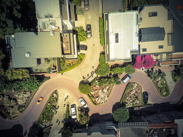 Vintage tone aerial Lombard Street, an east west street in San Francisco, California. Famous for steep, one-block section with eight hairpin turns. Crookedest, steep hills, sharp curves, one-way road