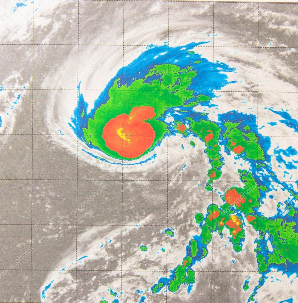 Infrared satellite imagery provides temperature data of tropical storm. Coldest cloud tops circling the center resembled a strawberry and leaf. Elements of this image furnished by NASA.