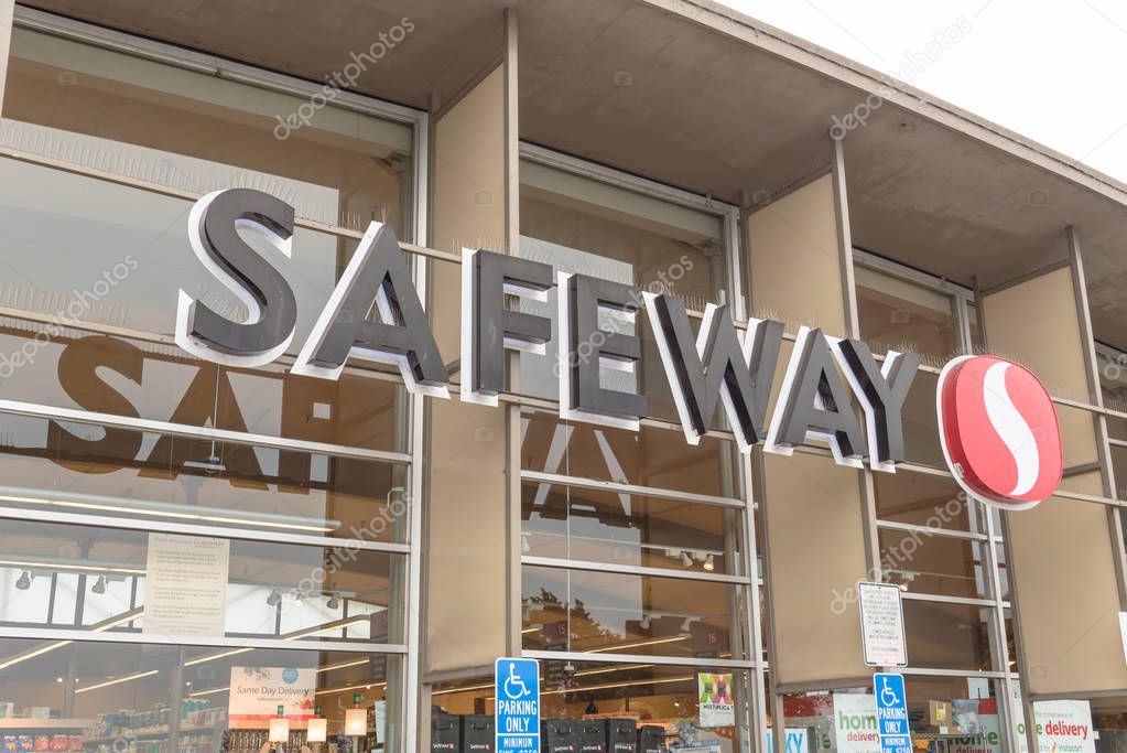 SAN FRANCISCO, CA, USA-JUL 17, 2018:Close-up Safeway grocery entrance store logo and handicap parking only sign. An American supermarket chain found in 1915, subsidiary of Albertsons, HQ in Pleasanton