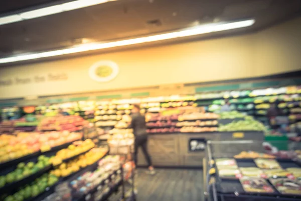 Vintage tone blurred background image customer shopping at local grocery store in San Francisco. Fresh fruits and vegetables on display. Organic, locally grown produces, healthy food in supermarket