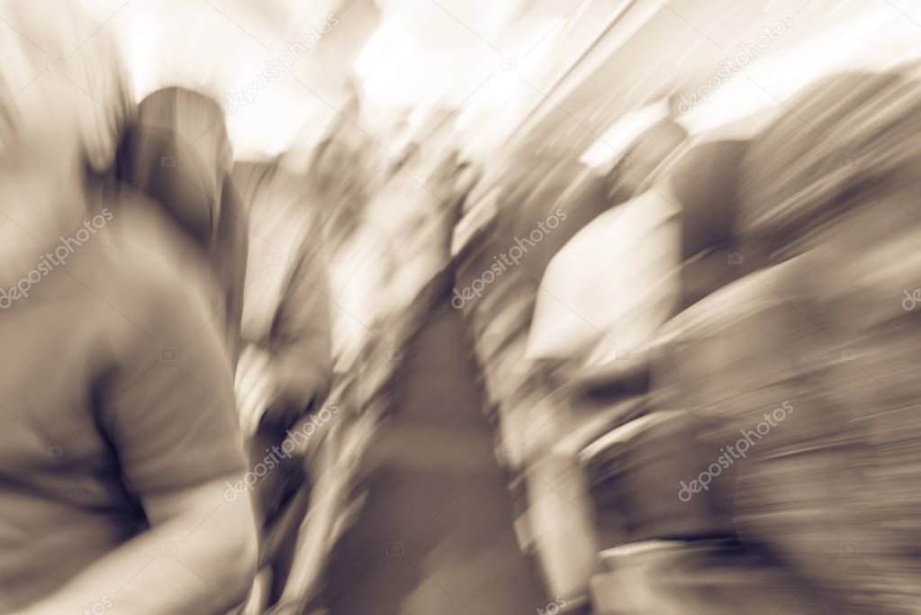 Vintage tone blurred motion diverse group of passenger on cabin of compact side airplane. Blurry background front view traveler or tourist onboard