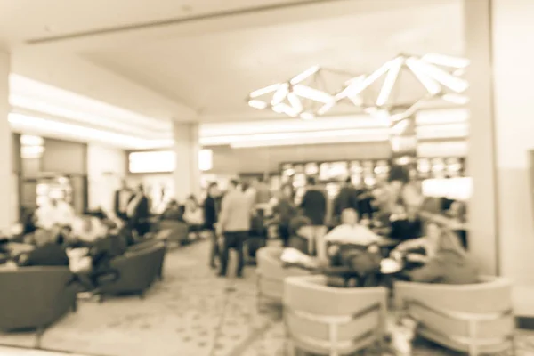 Vintage tone blurred motion people have happy hour, casual business meeting at the lobby of luxury hotel in San Francisco, California, USA. Blurry abstract background industry networking event