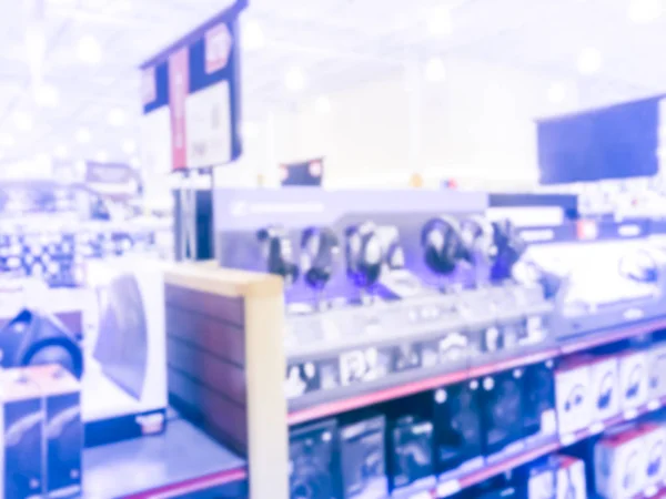 老式色调模糊背景耳机和演示站测试显示在美国德克萨斯州的电子商店 — 图库照片