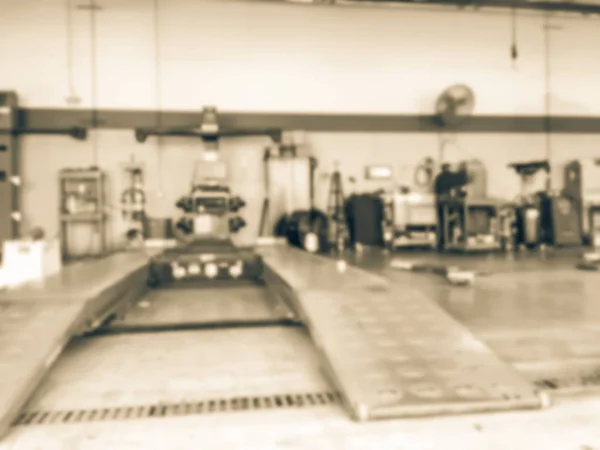 老式色调模糊抽象刹车服务为检查制动垫 液压在轮胎和服务中心在得克萨斯州 — 图库照片