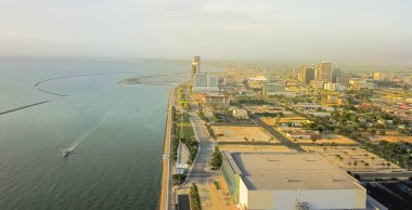 Panorama aerial view Corpus Christi downtown from North of Shoreline Boulevard with marina and yachts in the distance background. Waterfront area of Texas city on Gulf of Mexico clipart