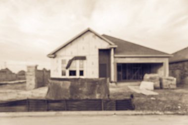 Vintage sesi bulanık görüntü ile yapım aşamasında ekli garajı ile yeni konut ev kum önünde Humble, Texas, bize. Ev inşaat ve gayrimenkul konsept arka plan