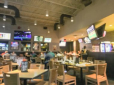 Bulanık soyut barlar restoranlar ABD spor. Ufuk kişi spor izle, bira içmek ve Amerikan mutfağı yemek