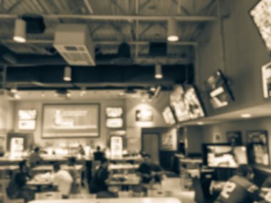 Vintage sesi soyut spor barlar restoranlar ABD'de bulanık. Ufuk kişi spor izle, bira içmek ve Amerikan mutfağı yemek