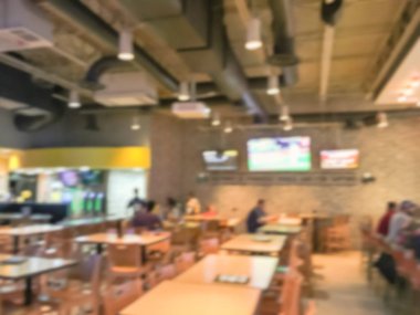 Bulanık soyut barlar restoranlar ABD spor. Ufuk kişi spor izle, bira içmek ve Amerikan mutfağı yemek