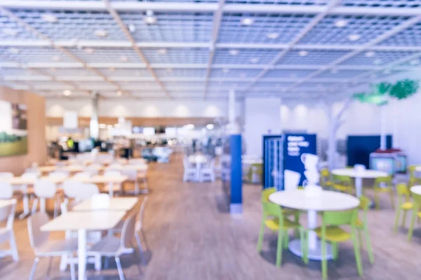 Blurred abstract huge cafeteria, restaurant, canteen, food court at shopping mall or corporate in Texas, America. Defocused modern public dining area for background use