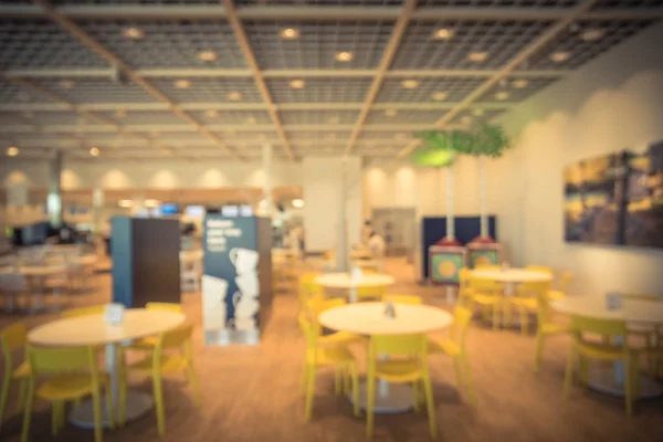 Blurred abstract huge cafeteria, restaurant, canteen, food court at shopping mall or corporate in Texas, America. Defocused modern public dining area for background use