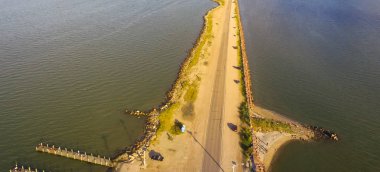 Panorama aerial view famous Texas City Dike with wooden piers, a levee that project nearly 5miles south-east into mouth of Galveston Bay. Designed to reduce impact of sediment accumulation along bay clipart