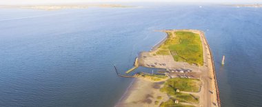 Panorama aerial view famous Texas City Dike, a levee that projects nearly 5miles south-east into mouth of Galveston Bay. It was designed to reduce the impact of sediment accumulation along lower Bay clipart
