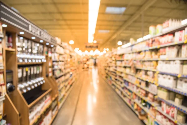 Kahve, çay, meyve suyu, Houston, Teksas, mağazada pişirme ve fındık ezmesi koridorda bulanık görüntü bize. Geniş süpermarket raflarında çeşitli ürünler ekran ile görüntüleyin. Ufuk bulanıklık arka plan, bokeh ışık