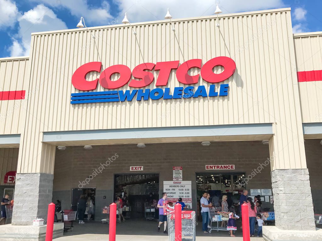 Lewisville, TX, USA-SEPT 15, 2018:Customers enter entrance, storefront of Costco Wholesale cloud blue sky. It the largest membership-only warehouse club in USA with total of 705 warehouses worldwide