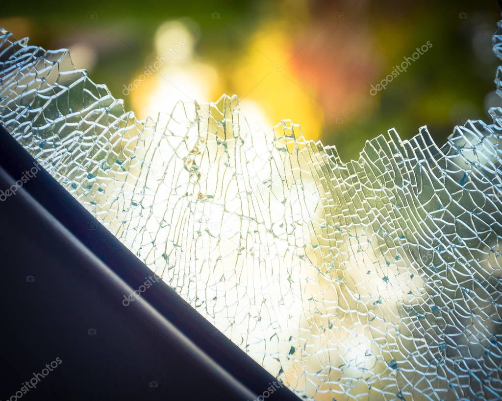 Vintage tone close-up outside view broken passenger window car smashed by thief or accident. Damaged glass from car theft. Motor Vehicle Insurance Claim Themed concept background.