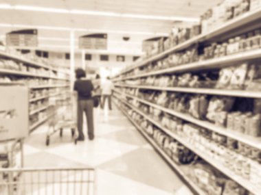 Vintage sesi bulanık müşteri konserve gıda ve Dallas, Texas, Asya süpermarkette bitkisel ilaçlar için alışveriş bize. Koridorları, satır mağaza zinciri içinde geleneksel ürün çeşitli ufuk arka plan