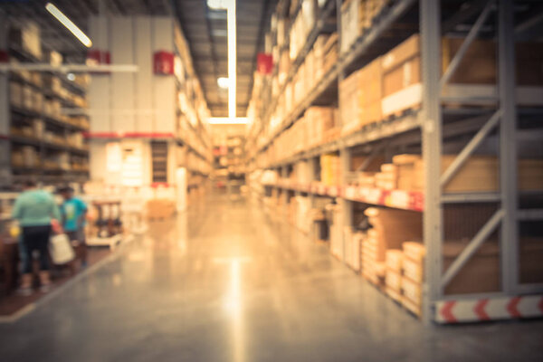 Blurry background customer shopping at large furniture retailer 