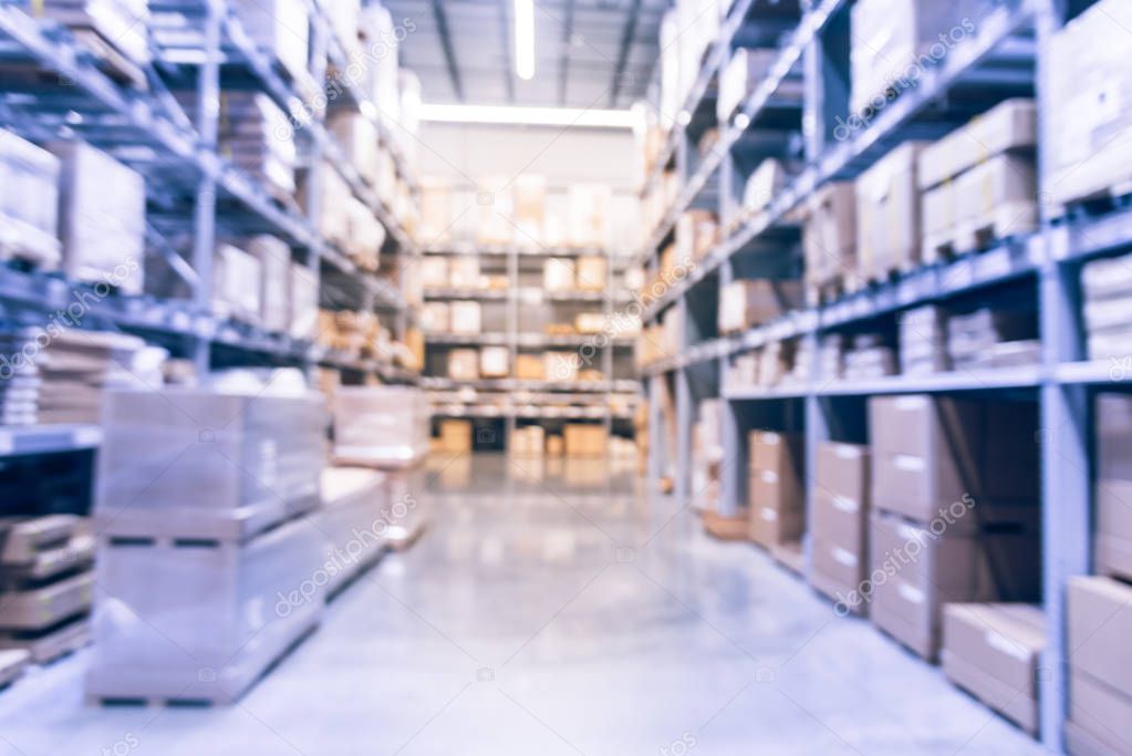 Vintage tone abstract blurred furniture retailer store with row of aisles, bins from floor to ceiling. Defocused background industrial storehouse inventory interior rack of big boxes home accessories