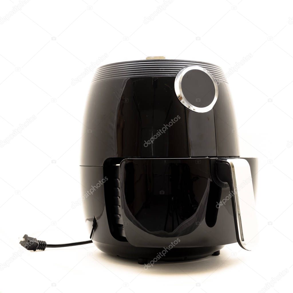 Studio shot of digital air fryer with power cord isolated on white background