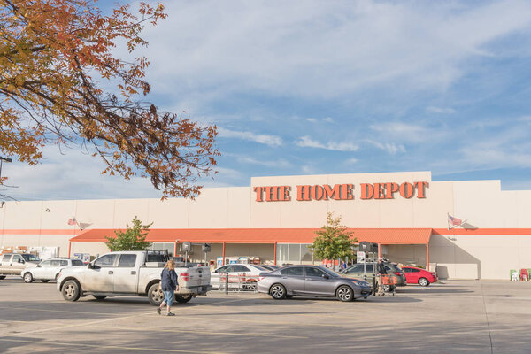 IRVING, TX, US-OCT 30, 2018:Customer enter Home Depot exterior storefront in autumn. A home improvement supply superstore, big-box that sells hardwares, construction products, tool rental services