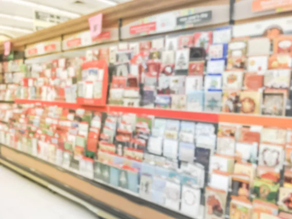Blurred abstract greeting cards and balloons display at grocery store in Texas, America.