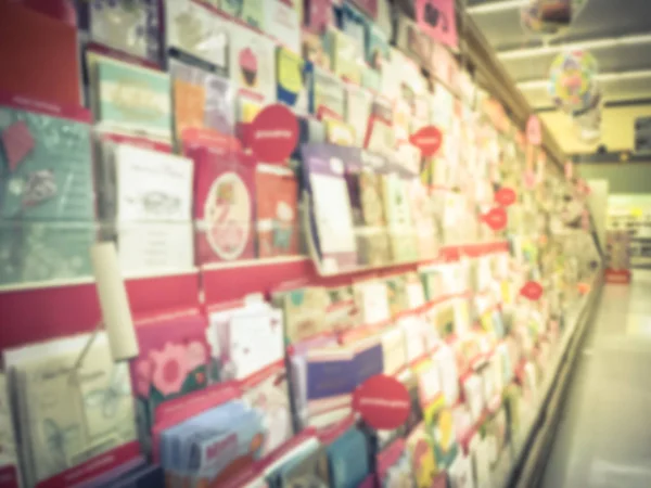 Vintage tone blurred abstract greeting cards and balloons display at grocery store in Texas, America.