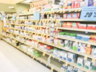 Vitamin ve ek indirimli fiyat etiketleri bakkal Texas, Amerika ile raflar ekranda bulanık resim varyasyonu.