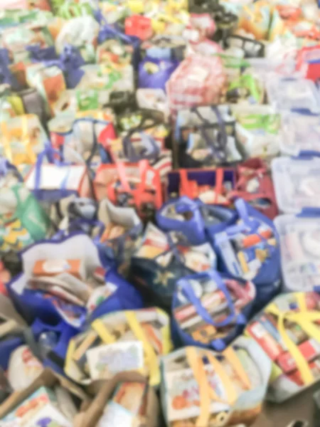 Verschwommene Abstrakte Stapel Von Wiederverwendbaren Lebensmitteltasche Mit Lebensmitteln Und Spielzeug — Stockfoto