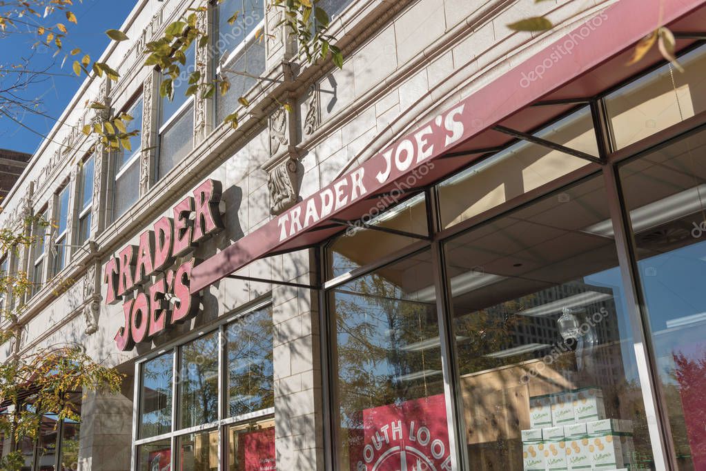 CHICAGO, IL, US-OCT 17, 2018: Close-up logo of Trader Joes's supermarket storefront in downtown Chicago. An American privately held chain of specialty grocery stores, discount retailer, own by ALDI
