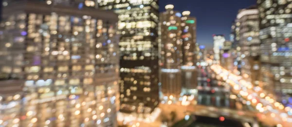 Panorama abstract blurred defocused of Chicago riverside office and residential building high-rise. Aerial view urban night light bokeh from illuminated skylines