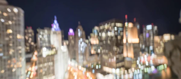 Panorama abstract blurred defocused of Chicago riverside office and residential building high-rise. Aerial view urban night light bokeh from illuminated skylines
