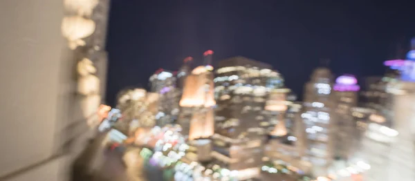 Panorama abstract blurred defocused of Chicago riverside office and residential building high-rise. Aerial view urban night light bokeh from illuminated skylines