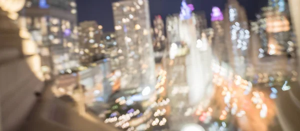 Panorama abstract blurred defocused of Chicago riverside office and residential building high-rise. Aerial view urban night light bokeh from illuminated skylines