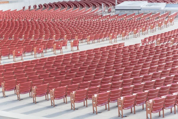 Line of raised orchestra level seats from public outdoor performing art venue in Chicago, front view