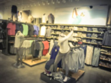 Vintage sesi hareket golf giyim, aksesuar ve dişli bölümü manken Amerika'da spor perakende mağazasında ile bulanık