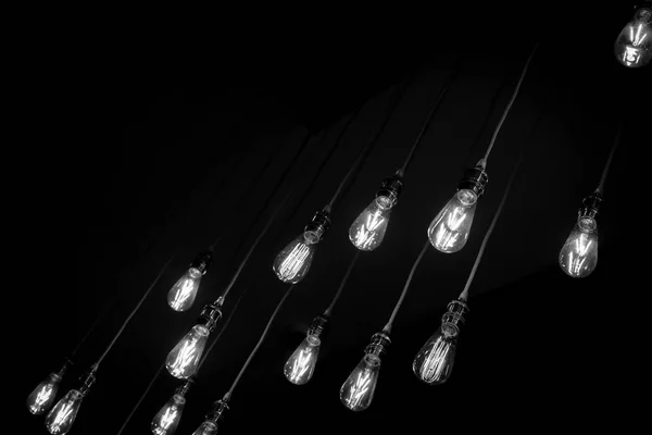 Vintage Tone Close Set Vintage Glowing Light Bulbs Hanging Black — Stock Photo, Image