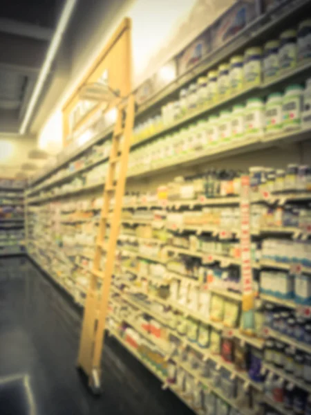 Pohybu Rozmazaný Řadu Vitaminu Doplnit Produkty Displeji Výsuvný Žebřík Obchodu — Stock fotografie