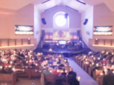 Soyut gelenek-in ışık mumlar ve şarkı harika bir gece birlikte Baptist Kilisesi Texas, ABD bulanık.