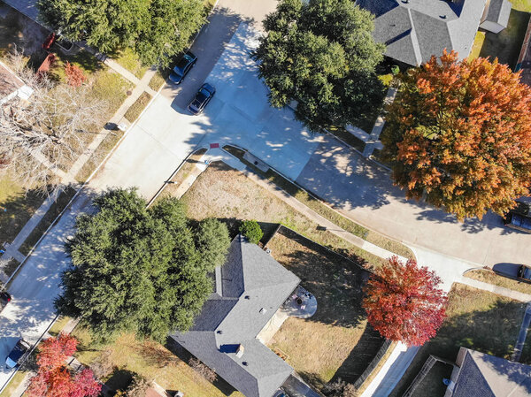 Aerial view residential neighborhood with colorful fall foliage suburban Dallas, Texas, USA. Straight down look as satellite style.