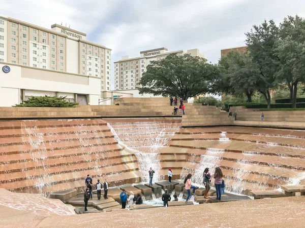 stock image FORT WORTH, TX, US-DEC 24, 2018:Water Gardens in downtown Fort Worth with visitors. A beautiful and refreshing oasis located downtown features three pools of water: aerating, quiet and active