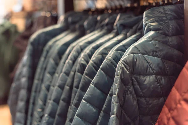 Row of women down jackets at American outdoor clothing store