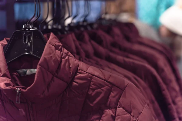 Row of women down jackets at American outdoor clothing store