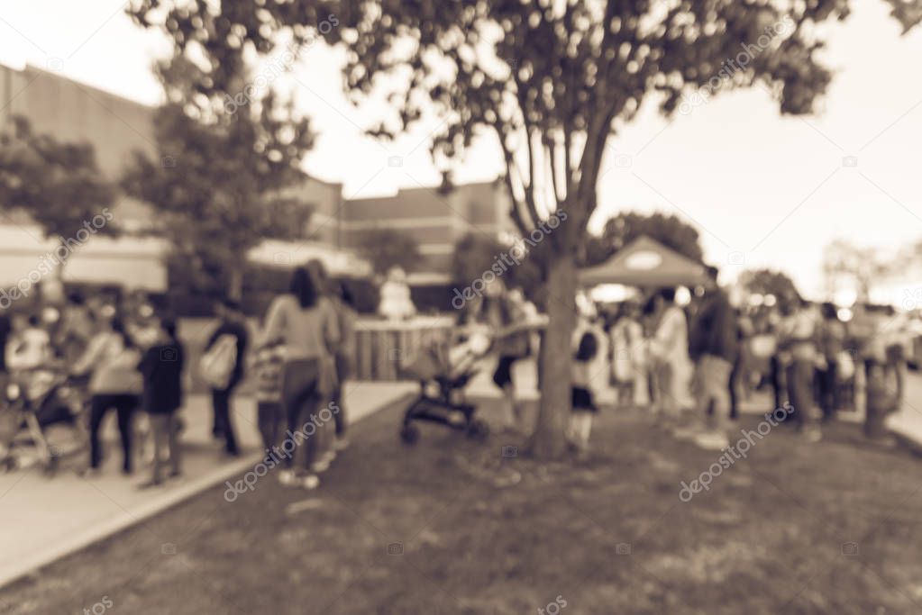 Filtered image blurry background crowed people at local Church f