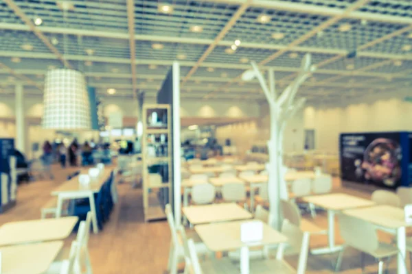 Filtered tone blurry background cafeteria at furniture retail st