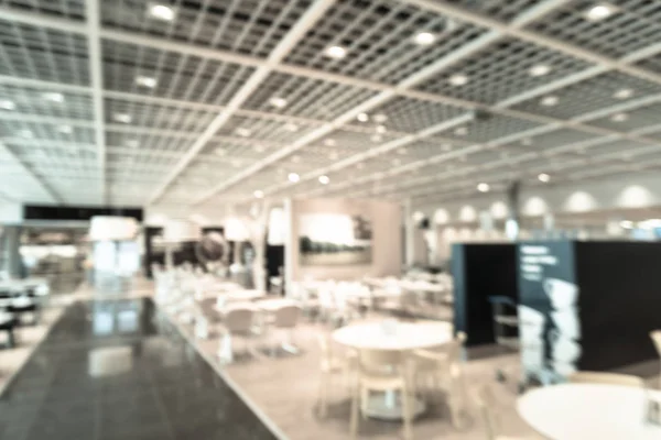 Filtered tone blurry background cafeteria at furniture retail st