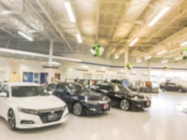 Blurry background inside huge car dealership in Texas, America — Stock Photo, Image