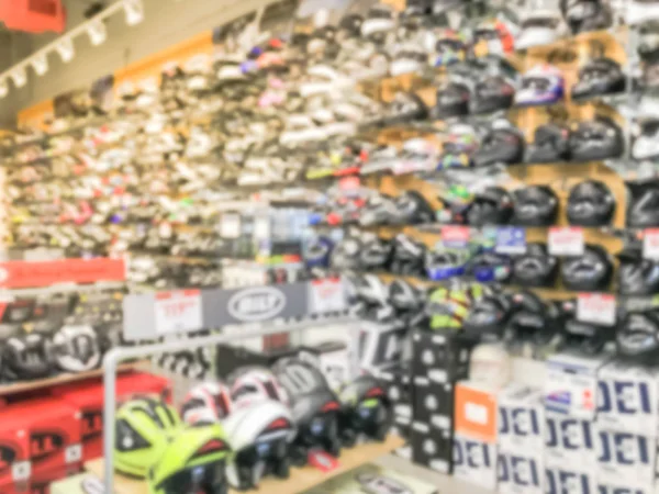 Blurry fondo variedad de casco de motocicleta en la tienda al por menor en Estados Unidos — Foto de Stock