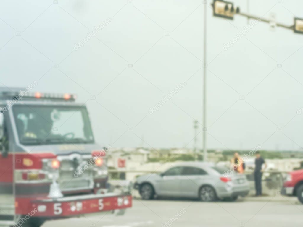 Blurry background accident at road intersection with fire truck